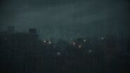 Raccoon City's skyline as seen in the Resident Evil 2 remake main menu.