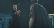 Slater seemingly executes Isaacs under the orders of Wesker.