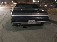 A classic Pontiac Fiero with an interesting Raccoon City license plate.