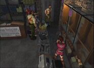 Claire shooting at zombies with her Hand Gun during gameplay