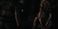 Jill Valentine faces Lisa Trevor inside the Cabin.