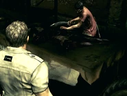 RE5DX10 2014-10-11 18-04-21-523.jpg (174 KB) Chris watching a Majini cut meat.