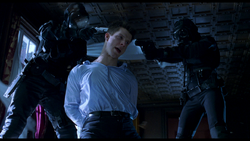 Resident Evil film - Matt gets detained by Sanitation Team.png