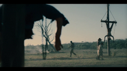 The Brotherhood prison convoy drives through an execution ground.