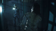 Leon aiming a zombie inside the Police Station