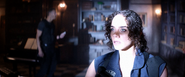 Jill notices Brad's helicopter about to crash into the library of the mansion.