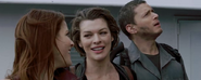 Chris continues watching the explosion as Claire smiles with Alice.