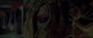 Lisa's eye as her body snaps inhumanly.