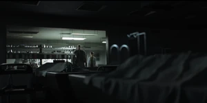 Chambers and Redfield overviewing the victims' corpses