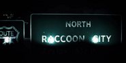 Highway directional signs to Raccoon City.