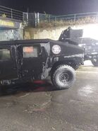 Two more Umbrella military vehicles, two old-school CW-era humvees (HMMWV), one with a mounted turret.