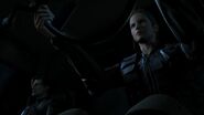 Angela driving a SRT vehicle with Leon accompanied.