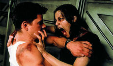 Resident Evil film - Undead Rain tries to bite Matt.jpg