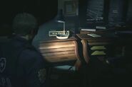 Rita's desk and name plate as seen in Resident Evil 2 remake.