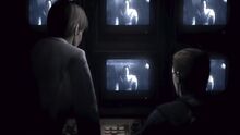 RE0 two men security cameras scene 6