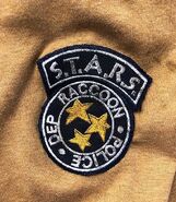 The S.T.A.R.S patch on Richard's shirt..