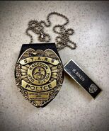 Richard's nametag and S.T.A.R.S badge.