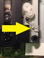 This screw attaches the grounding strip to the drive.
