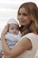 Emily Thorne Smiles While Holding Baby Carl David