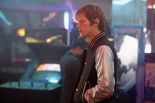 Nolan wears a Letterman Jacket