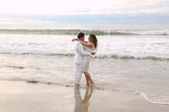 Amanda Grins While Hugging Jack by the Beach