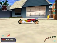 Barg's face on the wheels of RC Bandit, and in background, the garage door and a pickup with Barg's envstill.