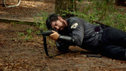 A Militia soldier fires at the group.