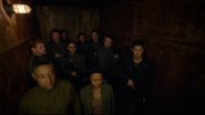 Tom, Jason, Grace and the Militia soldiers in the elevator.