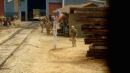 The Patriots chases after the group on the train.