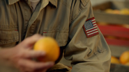 This Patriot is giving oranges to the townspeople of Willoughby.