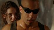 Kyra threatens Riddick with a shiv on the "Sweet Spot".