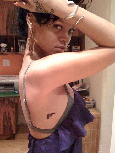 Rihanna New Cross Tattoo on Arm (Photo)