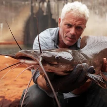 Jeremy holding a Vundu Catfish, a fish accused of dragging fishermen to their deaths in Africa's Zambezi River.