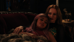 Toni and Cheryl snuggle up by the fire
