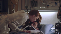 Cheryl kissing Fred's forehead