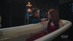 Betty puts Cheryl in the tub