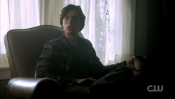 Season 1 Episode 10 The Lost Weekend Jughead sitting in a chair