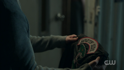 Season 1 Episode 13 The Sweet Hereafter Jughead holding Southside Serpent jacket 1