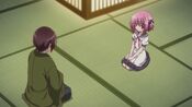 Tomoka is being admonished by her father.