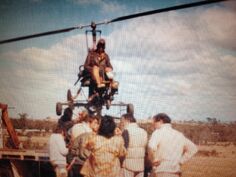 Bruce Spence in a close-up Gyrocopter mounted on a frame.