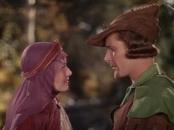 Olivia de Havilland as Marian and Errol Flynn as Robin Hood in The Adventures of Robin Hood (1938)