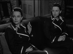 Olivia de Havilland as Terry and Ruth Collins in The Dark Mirror (1946).