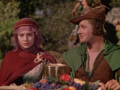 Olivia de Havilland as Marian and Errol Flynn as Robin Hood in The Adventures of Robin Hood (1938)