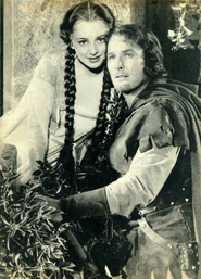 Olivia and Errol as Marian and Robin meeting at her window