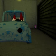 In the corner behind the orange key room car.