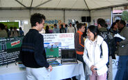 A picture of Shedletsky showing off the Roblox stand at the Stanford startup job fair.