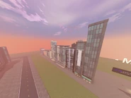 A group of buildings next to the modular building kit.