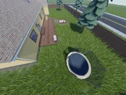 The outdoor area, featuring a sand castle and a trampoline.
