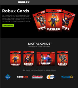 Fotografia do Stock: Roblox gift card in a hand over gift cards background.