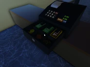 The cash drawer, featuring Robux, Tix, and old Roblox "R" coins.